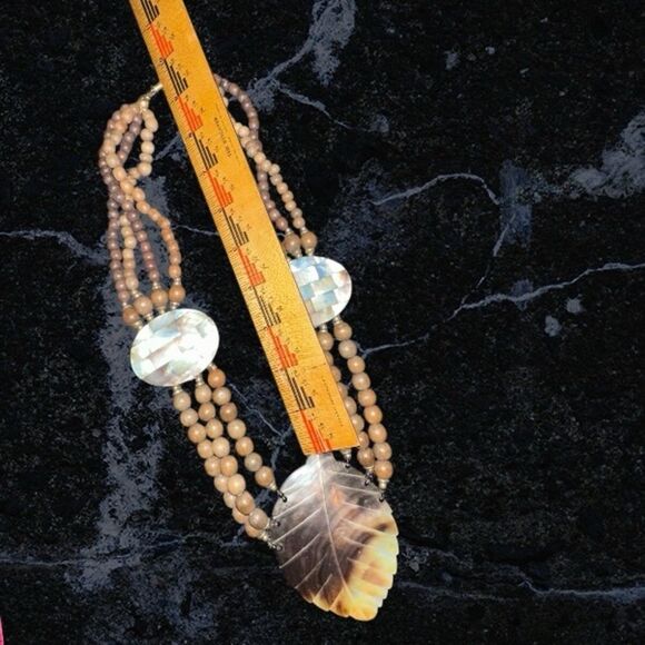 Elegant Brown Wooden Beaded Necklace with Carved Mother of Pearl Leaf Pendant - Picture 7 of 11